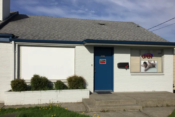 Exterior of 3846 South Warner Street with a blue entrance door