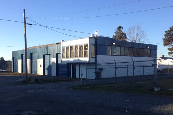 Blue building and fenced frontage shown for 3847 South Puget Sound Avenue